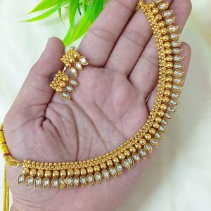 appears to be a traditional South Indian style gold-plated temple jewelry se