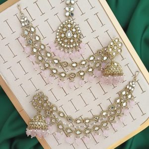 Pakistani-style mirror worked jhumka earrings and a tikli