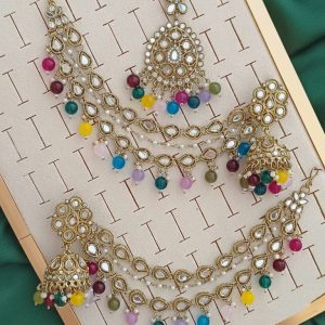 Pakistani-style mirror worked jhumka earrings and a tikli