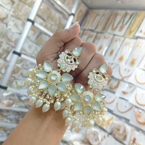 earrings are traditional Indian Kundan and pearl chandbali earrings
