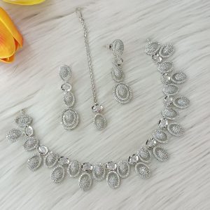 ewelry set is identified as a silver-plated American diamond necklace set