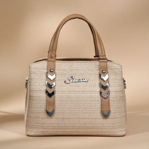 beige women’s handbag with decorative straps.