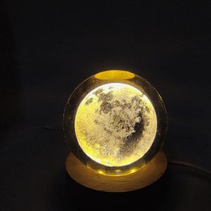 3D Galaxy Crystal Ball Night Light featuring a laser-engraved moon surface with a wooden base.  Material: Crafted from highly transparent crystal and wood.  Lighting: Equipped with energy-efficient LED technology, providing a warm white glow.  Power Source: Typically powered via a USB cord.  Dimensions: The crystal ball usually measures approximately 6 cm (2.4 inches) in diameter.  3D Crystal Ball Moon Lamp, LED Night Light, Decorative Table … * DESIGN: Beautiful 3D crystal ball lamp featuring detailed moon surface texture creates an enchanting ambient glow perfect for a…  Amazon.in  3D Galaxy Crystal Ball Night Light – Dimmable LED Table Lamp Brand: qbpatzwq. Color: Moon. Features: 【Highly Transparent Crystal Ball】The 3d planet crystal ball is made of high-quality crysta…  Ysvara Lifestyle  Moonlight 3d Crystal Ball Night Light – IndiaMART Mesmerizing Design · Crafted with a 2.4-inch glass ball and a sleek wooden base, this night light exudes elegance and charm, perfe…  IndiaMART  Show all