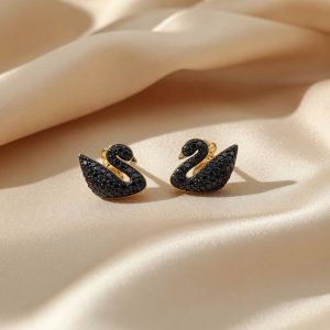 Swarovski Iconic Swan Stud Earrings in black, featuring a rose gold-tone plated finish and adorned with black crystals.