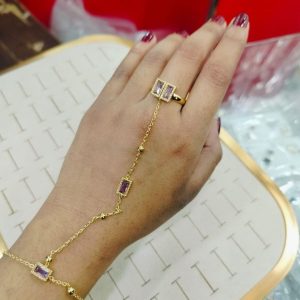 gold ring bracelet featuring rectangular stones.