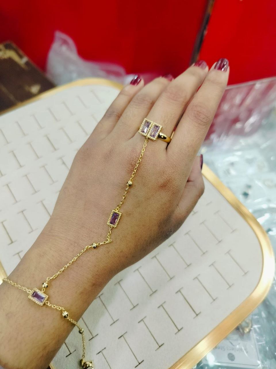 gold ring bracelet featuring rectangular stones.